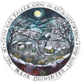 A circular vintage-style winter illustration with the text 'IN THE BLEAK MIDWINTER, LONG AGO' around the border and 'SNOW HAD FALLEN, SNOW ON SNOW, SNOW ON SNOW' at the top. The scene shows snow-covered houses, bare trees, a full moon, hills and with deer in the foreground.