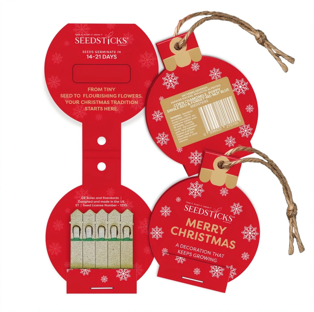 Seedsticks Christmas bauble shaped seed packets with white snowflakes, gold ribbon, and twine loops, shown on a plain white background. The packagng is open to show the actual seedsticks.