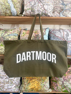 Green tote bag with 'Dartmoor' text on a background of maps