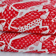 Close up of Dogs Tea Towel in red and cream by Cambridge Imprint
