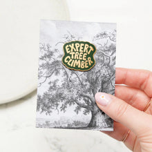 Expert Tree Climber Enamel pin in green and gold on backing card featuring tree illustration