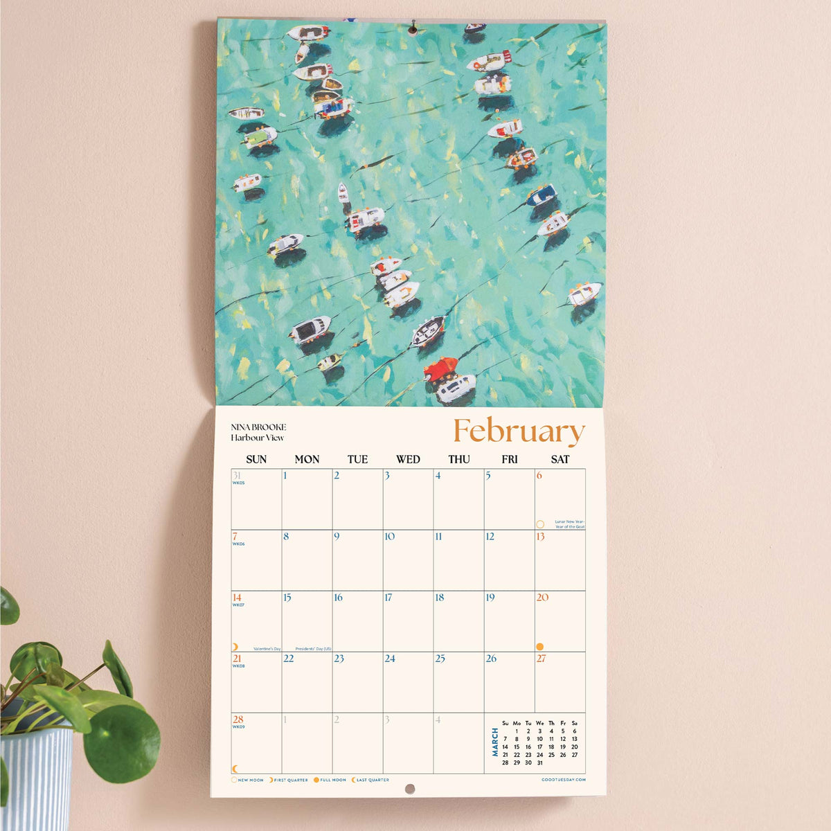 Calendar with a colorful illustration of boats on a water background