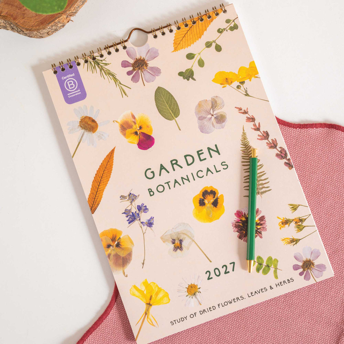 2027 garden botanicals planner with flowers and leaves on a white background