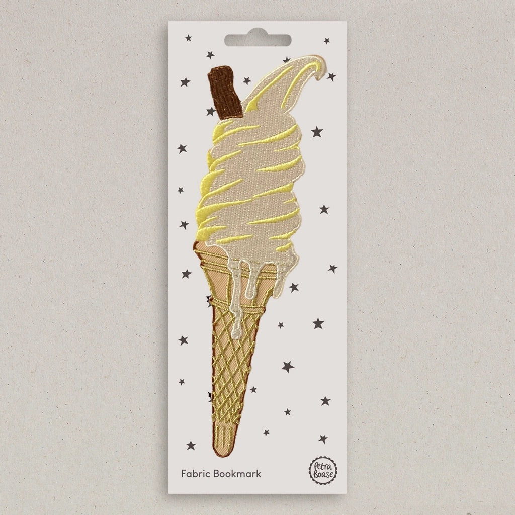 An embroidered fabric bookmark shaped like a soft-ice cream in a waffle cone, mounted on a white backing card with small black star details. The backing card is labeled 'Fabric Bookmark' and shows the 'Petra Boase' brand logo.