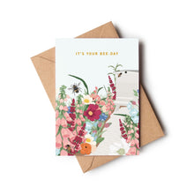 Floral birthday card with a beehive and bees, the pun 'It's Your Bee-Day' is written across the top.