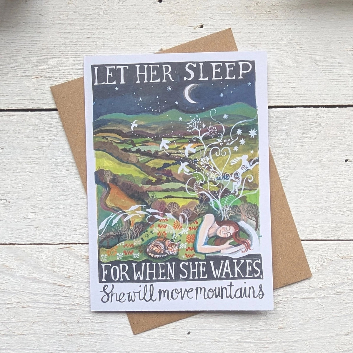 Greeting card with an illustration of a woman sleeping and text 'Let her sleep, for when she wakes, she will move mountains'.
