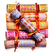 A stack of colourful Cambridge Imprint Christmas crackers with orange ribbons, featuring various festive patterns in pink, orange, yellow, and blue on a white background.