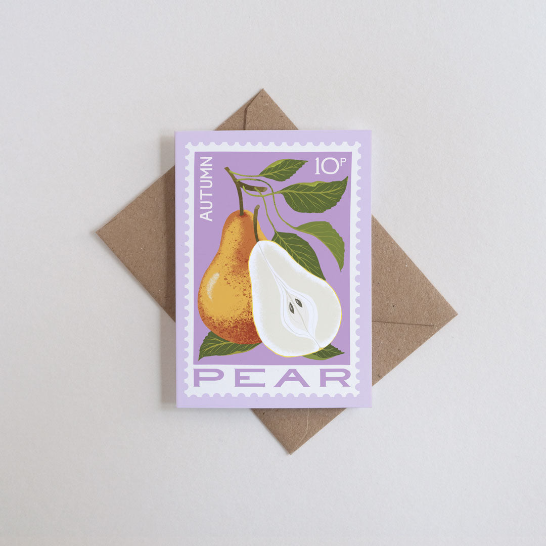 Mini greetings card featuring illustration of a pear in the style of a postage stamp with a lilac background and brown kraft envelope.