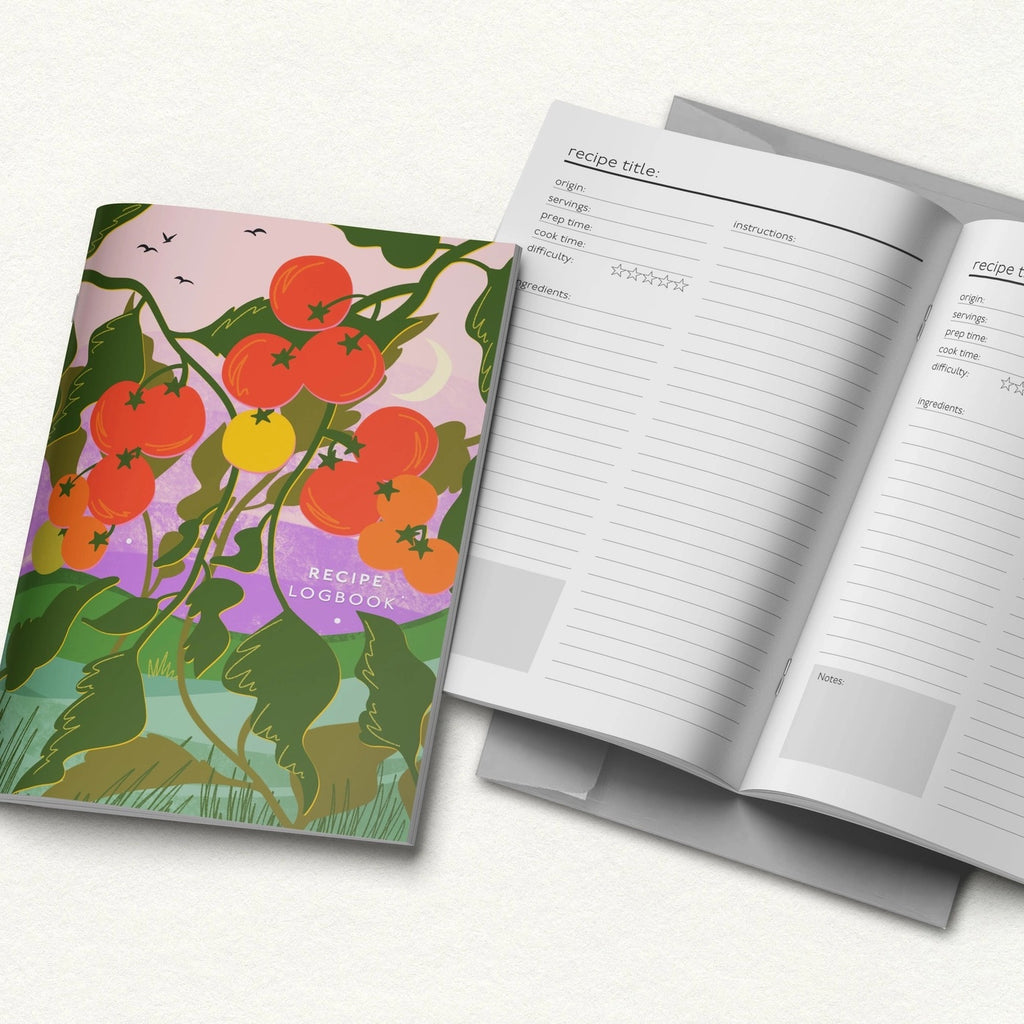 Recipe logbook with tomato-themed cover and open pages on a white background