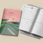 An illustrated running logbook shown closed and open on a light beige background. The closed cover features a pink sky, green landscape, and the title 'RUNNING LOGBOOK.