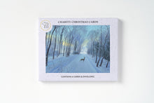 Charity Christmas Cards gift set in a white speckled box featuring a winter forest illustration with a deer on a snowy path, shown on a clean white background.