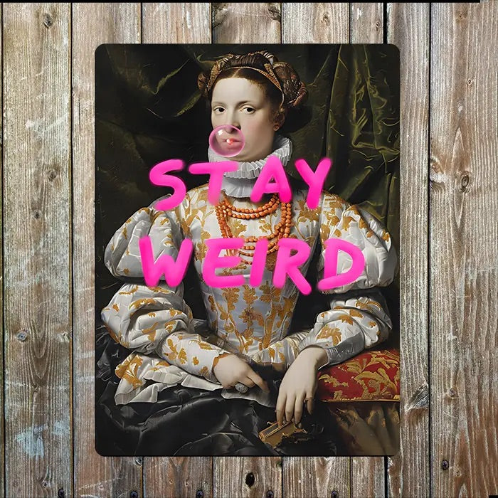 Sign with historiccal style portrait with 'Stay Weird' text overlay in bright pink on a wooden background