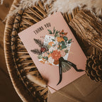 Pink 'Thank You' card with a floral bouquet displayed in an autumanl basket.