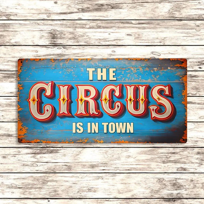 Vintage-style sign with 'The Circus is in Town' text on a wooden background