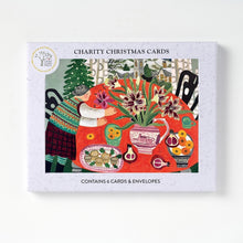 6 Charity Christmas Cards boxed featuring a colorful illustrated cover with a festive table scene.