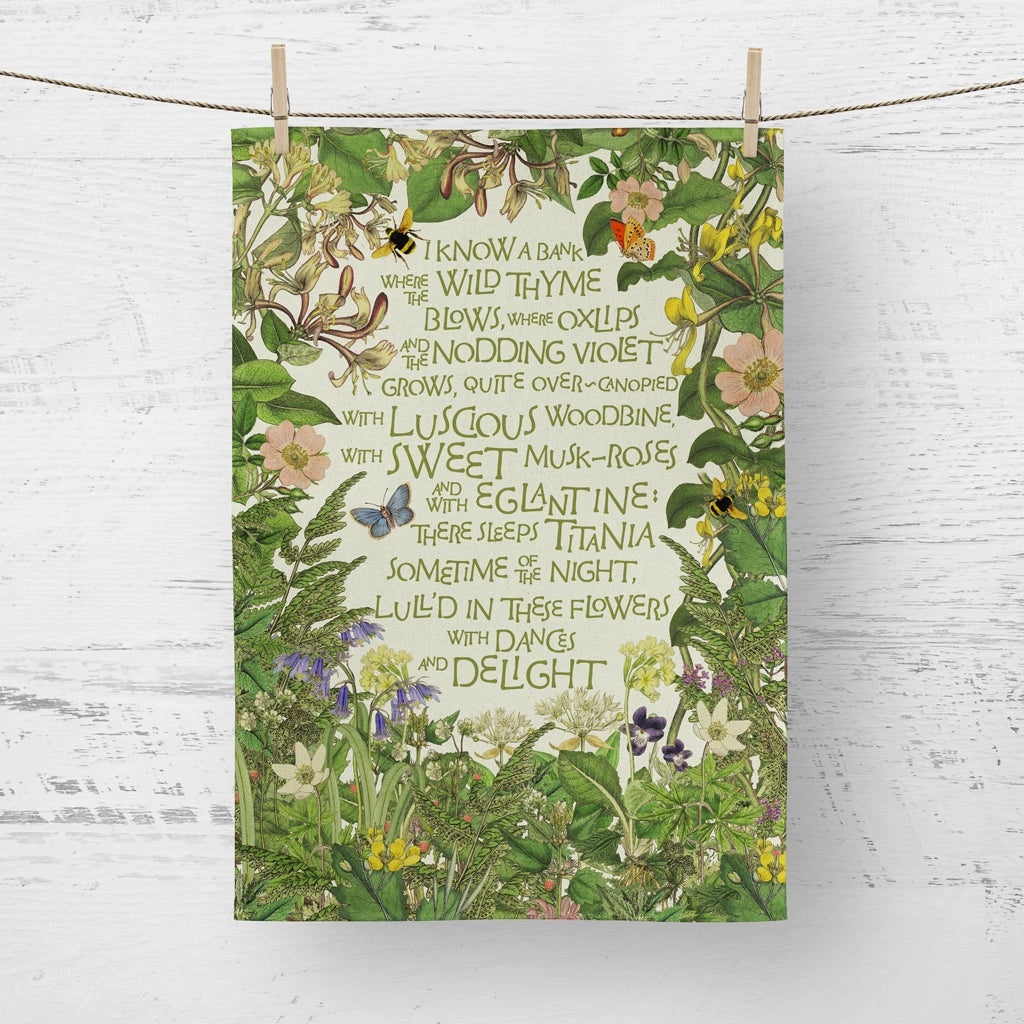 Floral tea towel design with text and butterflies on a white wooden background
