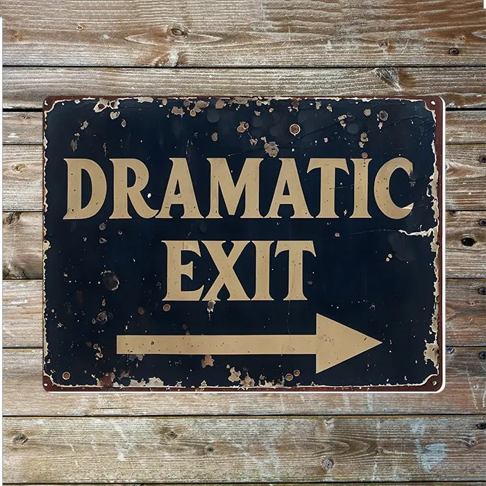 Vintage-style sign with 'Dramatic Exit' text and right pointing arrow on a wooden background