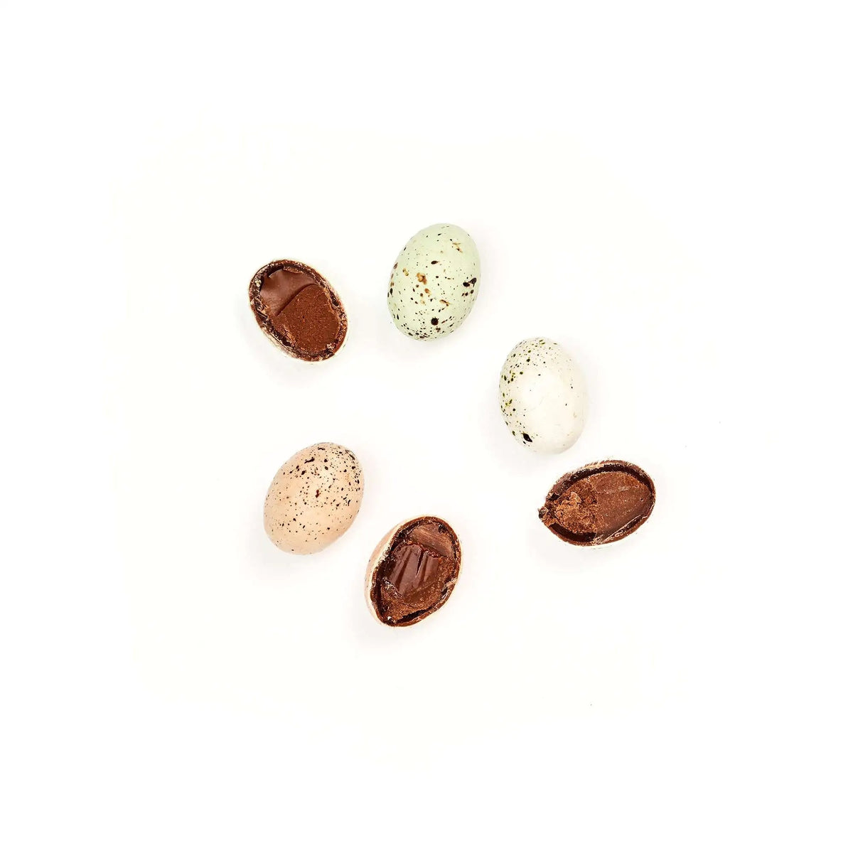 Assorted chocolate eggs on a white background